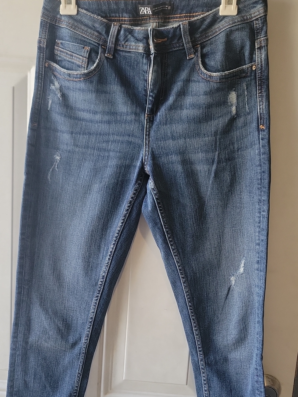 Zara women’s jeans size US 8 skinny denim w/ rips near knees. Lightly worn.